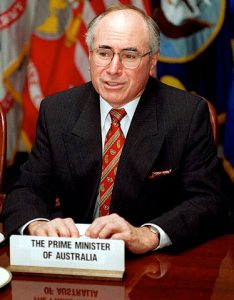 John Howard sitting at his seat in the United Nations